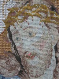 head detail of needlepoint
